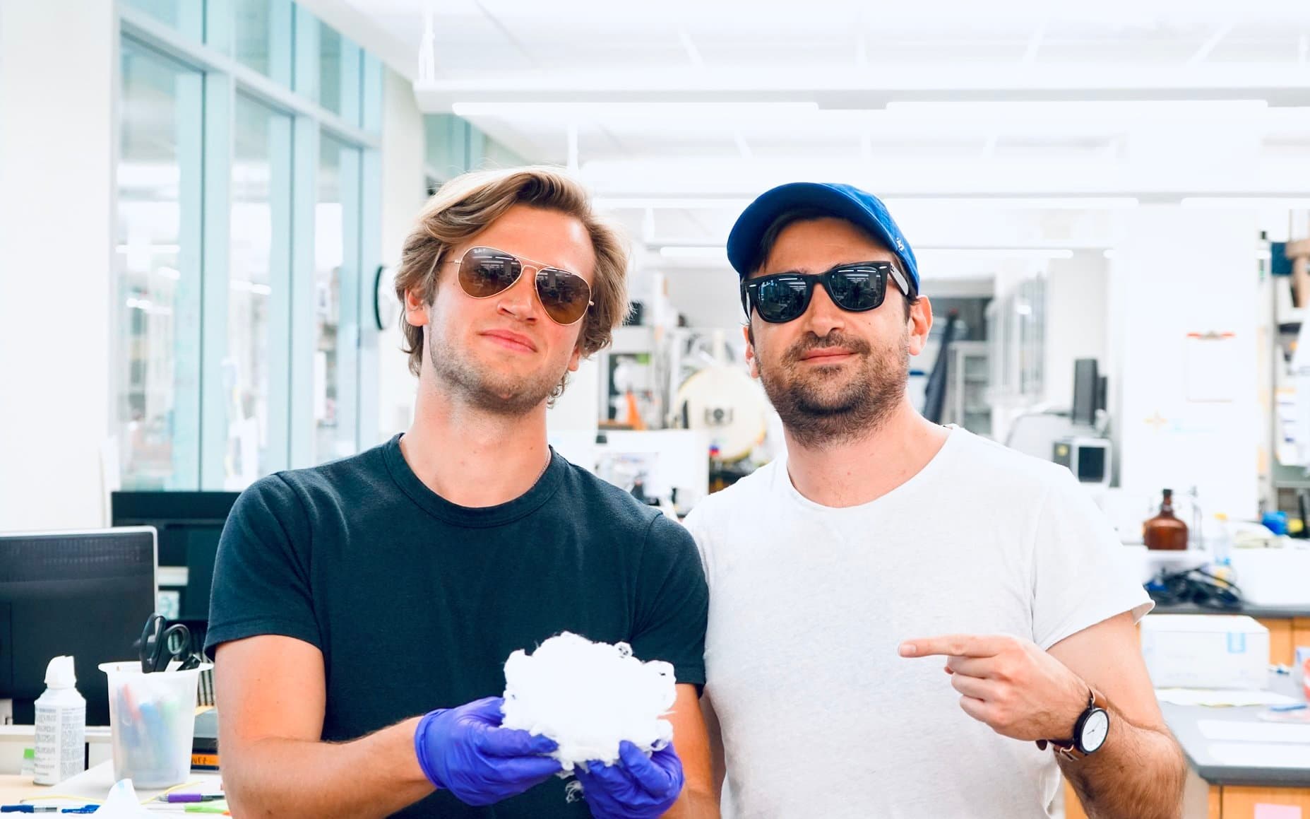 Dave and Nikita holding cotton candy-like N95 fibers